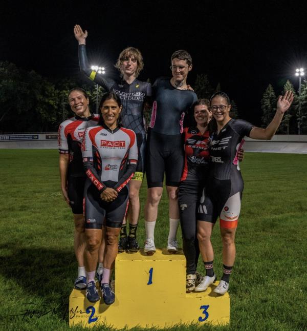 Tessa Johnson and Evelyn Williamson stand atop the podium in August after winning the Illinois state women's championship.